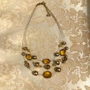 Delicate pale gold and brass necklace
